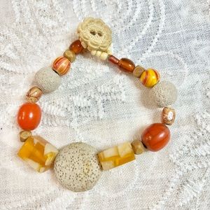 Boho bracelet 9 ½” Lava stone, acrylics, wood, glass beads.